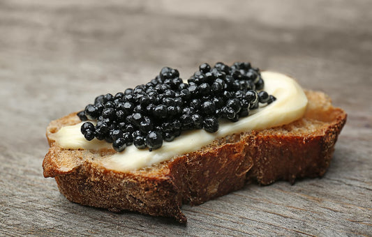 White bread with Sturgeon Black Caviar and butter on top.