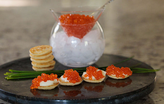 Salmon roe on mini blini